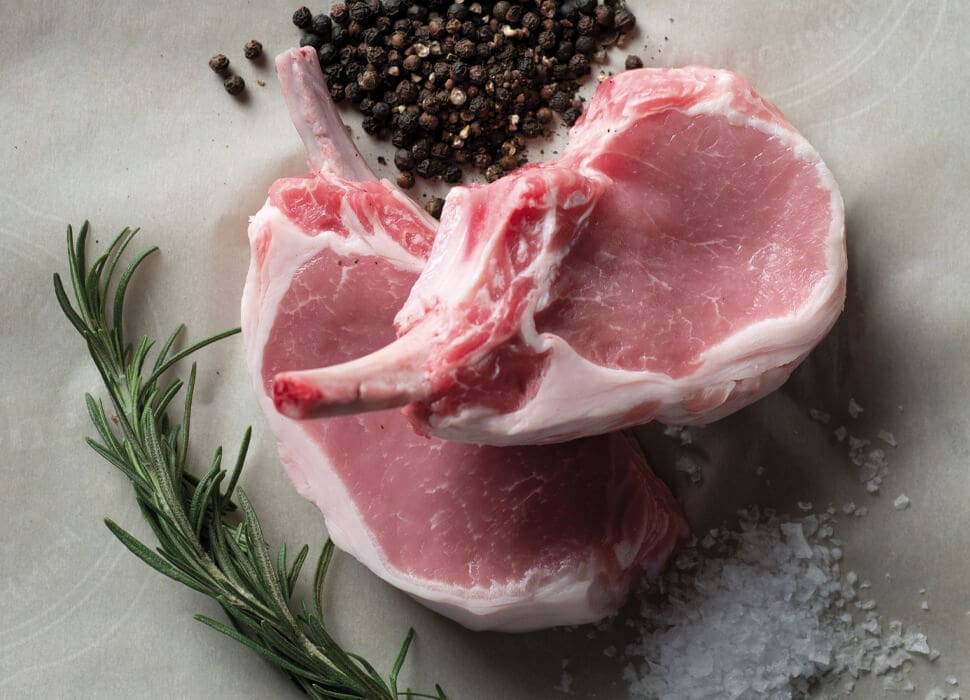 uncooked bone-in chops with spices