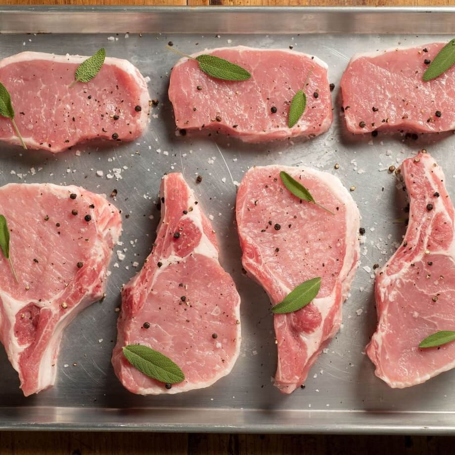 How to Perfectly Grill Pork 2 pork chops baking sheet spices
