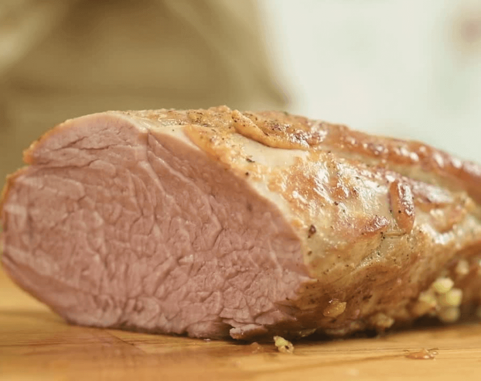 How to Cook the Perfect Pork Tenderloin 4 Pork tenderloin on a wooden cutting board