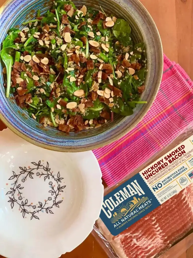 Can You Cook Bacon in an Air Fryer? 3 Hickory smoked bacon sitting next to a bowl of salad